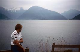 Shane enjoys the incredible view from just opposite the hostel at Vangsnes. To the left is Balestrand, where we will be staying near the end of the tour; Dragsvik is in the middle, and Hella, our destination tomorrow, is on the right [Remastered scan, 23/9/2019]