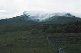 Mist pouring into Loch Scamadal on Skye, with the Old Man of Storr visible behind [New scan, July 2019]