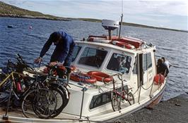 Mr McAskell loads the final bikes onto the Endeavour of Berneray ferry before setting off for the Isle of Harris.  The Moulton gets its own special loading bay for some reason. [Remastered scan, July 2019]