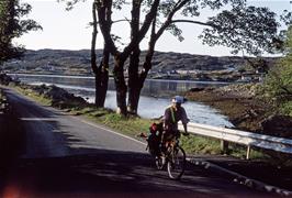 One of our members riding along Culag Road, Lochinver, with Badidarach visible on the far side of the Loch [New scan, July 2019]