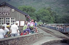 The crew watch one of the miniature trains leave Dalegarth Station on the Ravenglass & Eskdale Railway [Remastered scan, June 2019]