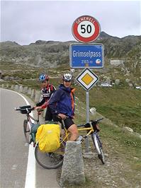Tao and Gavin at the Grimsel Pass sign, 27.5 miles from Brienz and 2143m above sea level - the top is just around the corner
