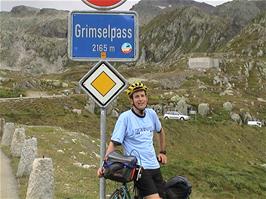 Michael at the Grimsel Pass sign, 27.5 miles from Brienz and 2143m above sea level - the top is just around the corner