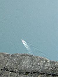 Olly's next photo, over another edge of Pulpit Rock, shows a large boat on the fjord far below