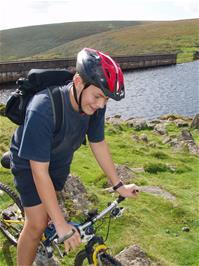 Ben Parker rides along the bridleway past the Avon Reservoir