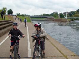 Ashley and Zac wait by the canal while youngsters from Millfield School begin to ride in our direction