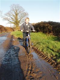 Alex demonstrating his love of muddy puddles near Staverton