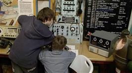 Zac and Ash try out the maritime communication equipment at the Shipwreck Heritage Centre, Charlestown