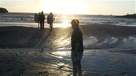 Ash heading out for an evening swim at Treyarnon Bay