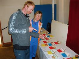 Charles and Heidi admire the egg display at Rattery Poultry Show