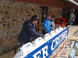 Zac, Olly and Ashley play with the radio-controlled boats at Charlestown museum