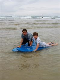 Zac and Ashley get to grips with our rented surf boards at Perranporth