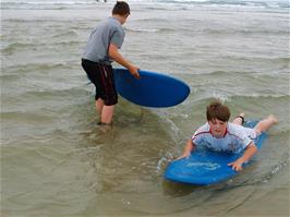 Zac and Ashley get to grips with our rented surf boards at Perranporth