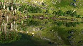 Glorious mountain reflections seen from the train from Fort William to Mallaig