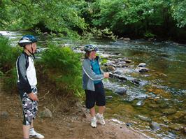 Ash and Callum skim stones across the Dart in Hembury Woods