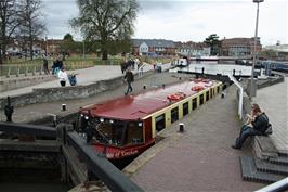 A barge exits the final lock on the Stratford-upon-Avon Canal