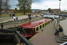A barge exits the final lock on the Stratford-upon-Avon Canal
