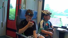 Will and John on the train from Brunnen to Lucerne after our 33.4 cycling miles from Hospental