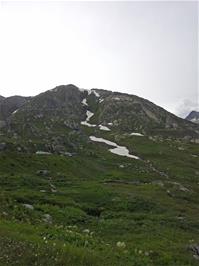 Snow on the surrounding mountains at Grimsel Pass