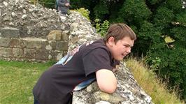 Dillan looks down at the foundations of the original Salisbury Cathedral at Old Sarum