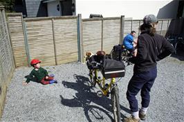 An unconventional way of carrying child and dog on a tandem, at Holne café