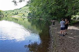 Stone skimming on the banks of Grasmere