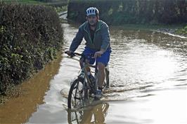 Gavin returns from his test ride through the lake near Landscove with soaked feet, so it really is as deep as it looks!
