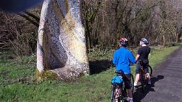 George and Dillan admire the mosaic sculpture on the Tarka Trail, which includes quotes from the book Tarka the Otter, 4.7 miles into the ride