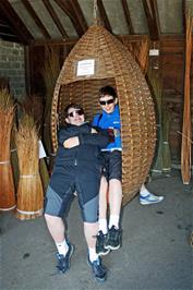 Dillan and George share the wicker Hanging Pod Chair at the Willows and Wetlands Centre