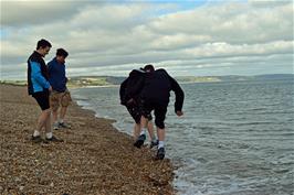Dillan and George get wet on the beach at Torcross