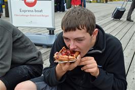 Dillan enjoys a very tasty waffle on Flåm quay