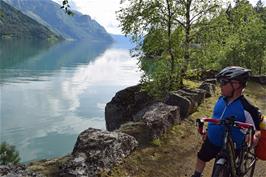 John admires Lustrafjorden from the abandoned cycle route near the Otta tunnel