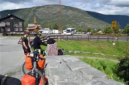 Outside the Norsk Fjellsenter, Lom, with Lom Stave Church in the distance