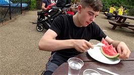 Dillan tucks into his watermelon at the Boathouse Café, Regents Park, London