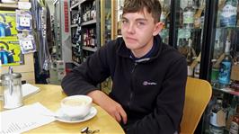 Dillan enjoying a very good value latte in the Ardgay Highland Coffee Shop