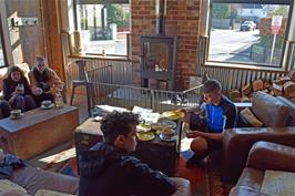 Jude and Dillan enjoying excellent coffees by the fire in Café 3 Sixty, Bovey Tracey