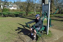 Dillan pushes himself to the limit on one of the outdoor exercise machines in Mill Marsh Park, Bovey Tracey