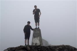 Dillan and Jude on the Ben Nevis trig point - 1345m above sea level