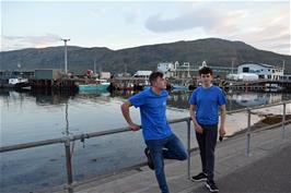 Dillan and Jude on Shore Street, Ullapool, with the ferry pier behind