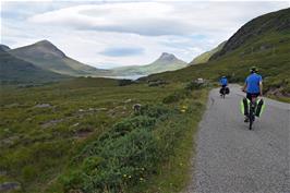 Dillan and Jude cycle off towards the impressive Stac Pollaidh from near Drumrunie