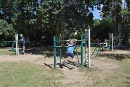 Enjoying the outdoor gym equipment in the park at Bovey Tracey