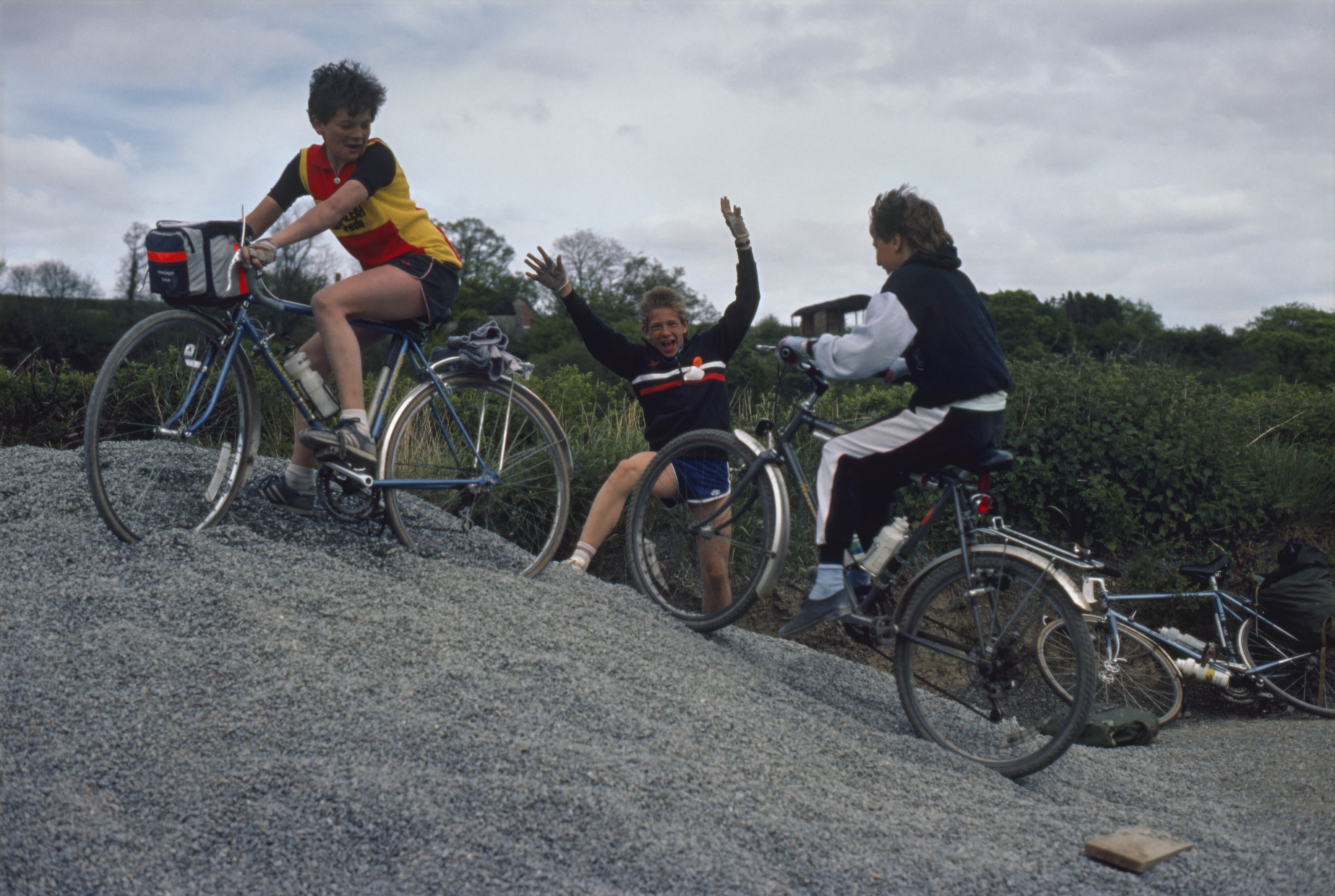 Jason, Marc and Gareth cheekily ride the council gravel piles at the start. Near Burnwell, between Bridford and Sowton Cott Bridges.