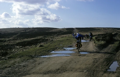 Riding the Quantock track from Hurley Beacon towards Bicknoller Post, puddles gleaming in the sun.