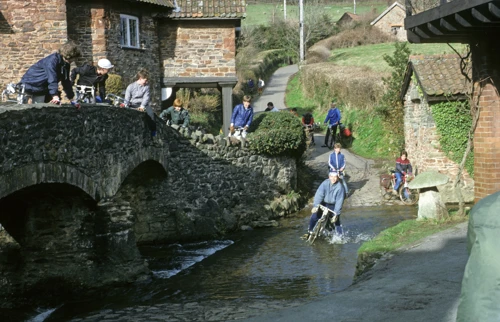 David Parry stalls through Allerford’s ford as the gang watches from the bridge.