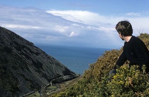 John Stuart pauses above Heddon’s Mouth Cleave, gazing towards the sea on the path to Woody Bay.
