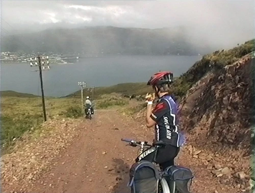 Track descent to the Alltnaharrie Inn, 37.1 miles from Carn Dearg, with Ullapool visible across Loch Broom.