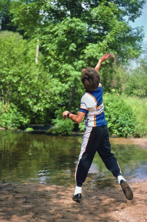 Chris lobs a large stick across North Bovey ford, trying to drench Richard Burge.