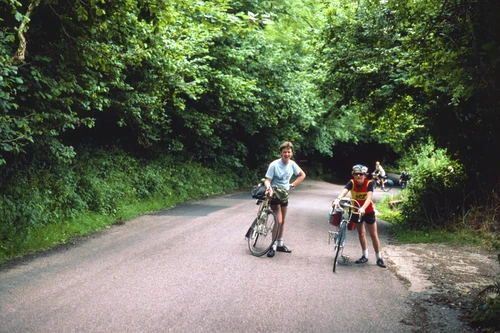 John and Jason pause on Salcombe Hill Road from Sidmouth, the day’s steepest climb. Richard Burge and Gary follow; still dry.
