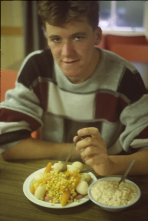 Post-shower at Garramore Youth Hostel, Michael Hall tackles his self-prepared veg mountain, with rice pudding to finish.