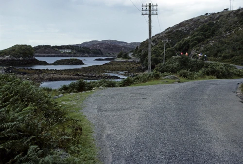 The group rides beside the timeless beauty of Enard Bay, 25 miles in.